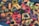 A collection of various colorful plastic objects, including rings, round shapes, and small figurines. The objects are scattered randomly, creating a dense and chaotic arrangement with an assortment of shapes and colors. Some items appear to have small black caps on them.