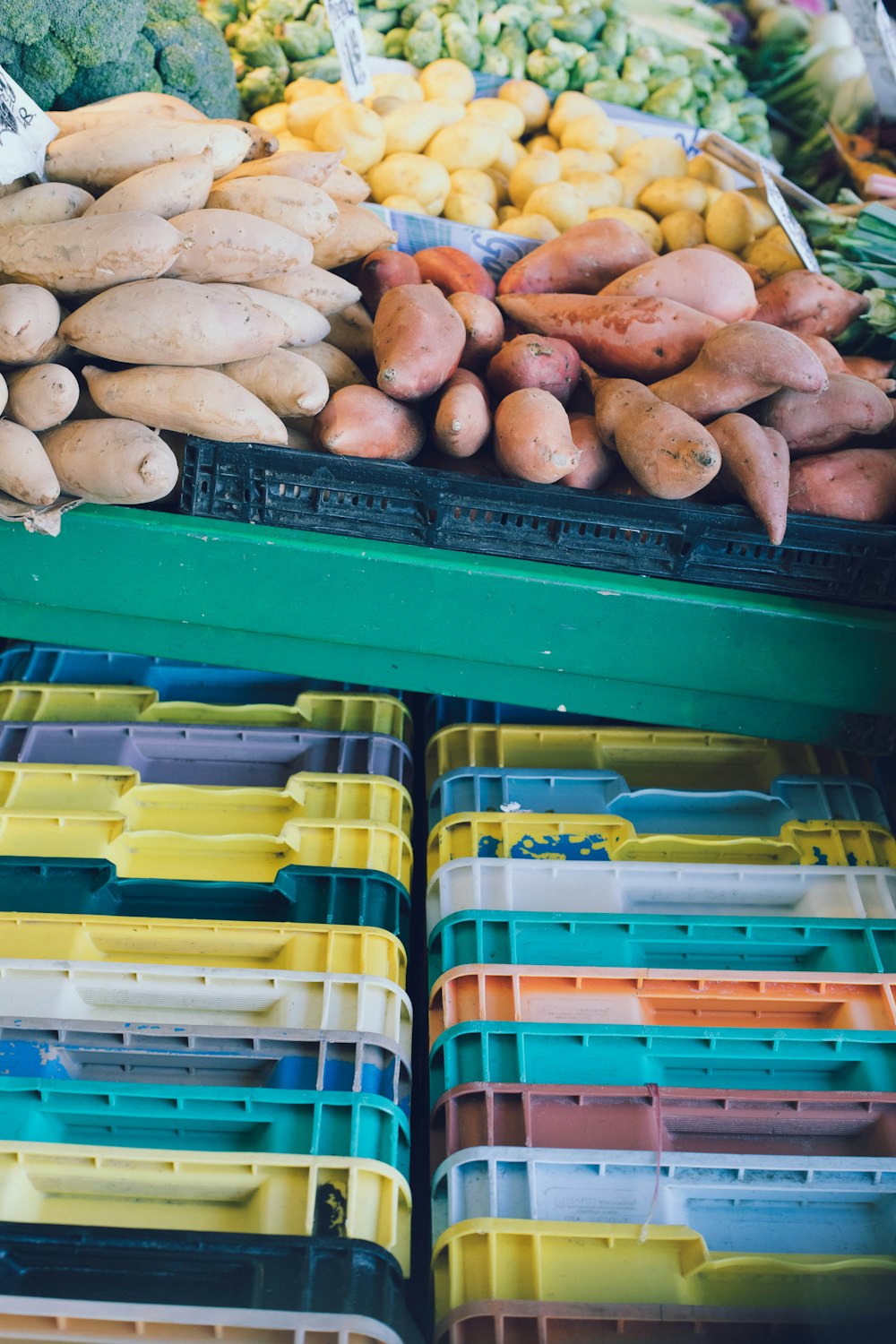 a variety of vegetables are on display at a market