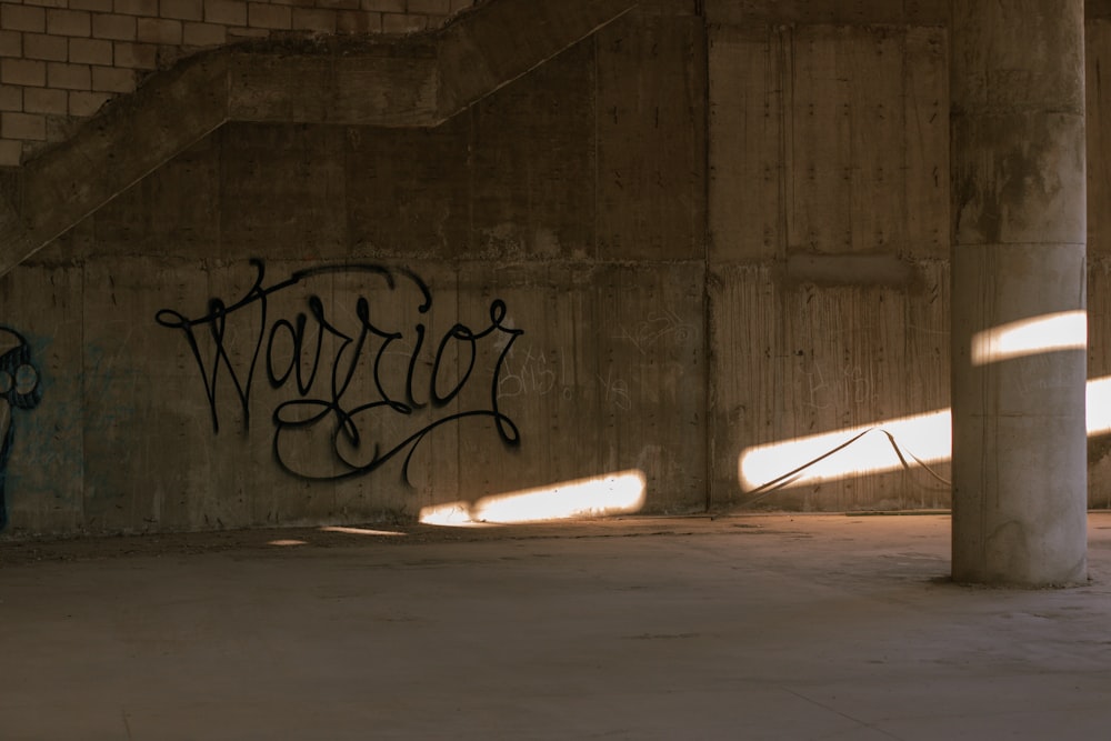 a man riding a skateboard down a cement wall