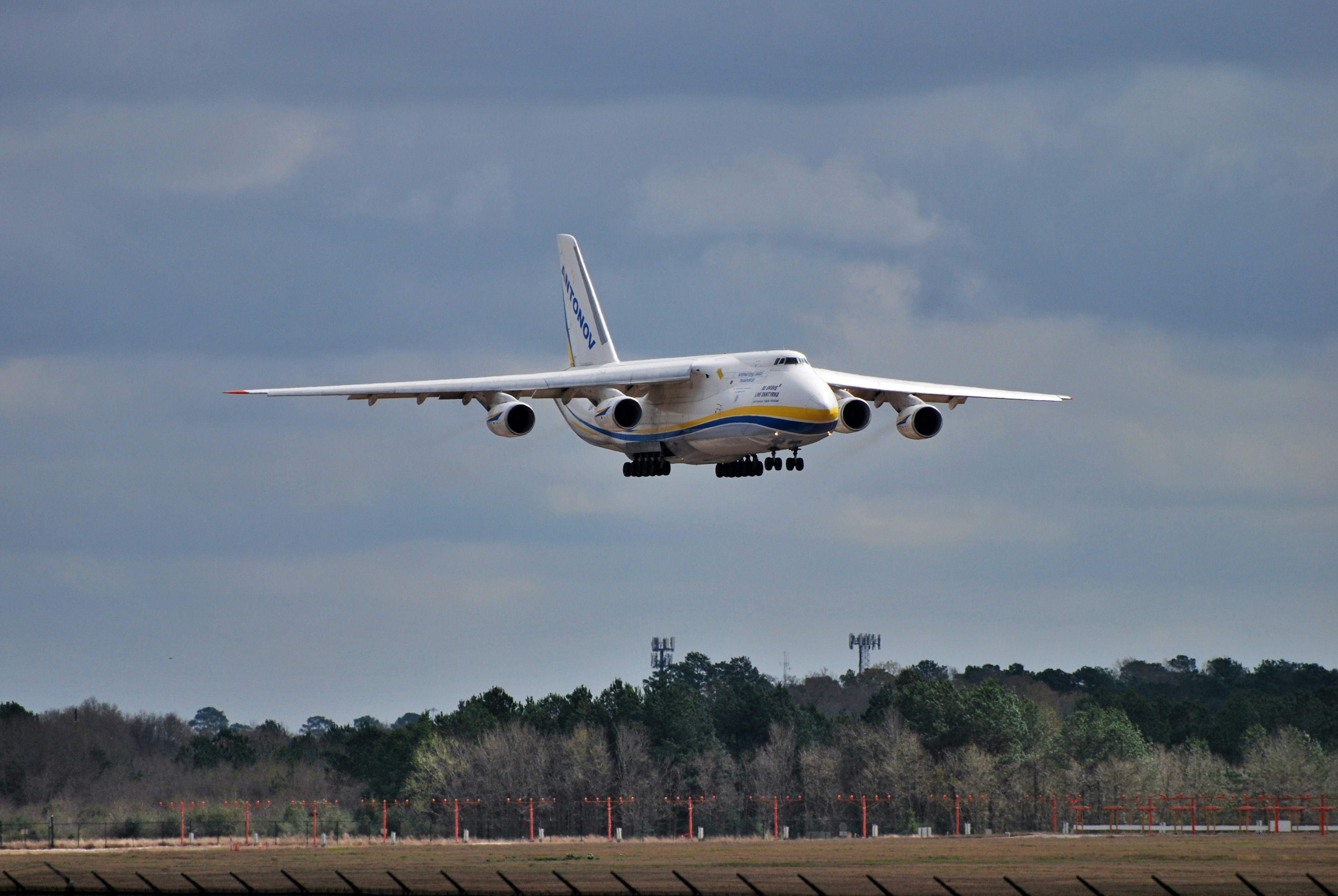 a large jetliner taking off from an airport runway, Antonov A124 PANC-KIAH | Anchorage to Houston