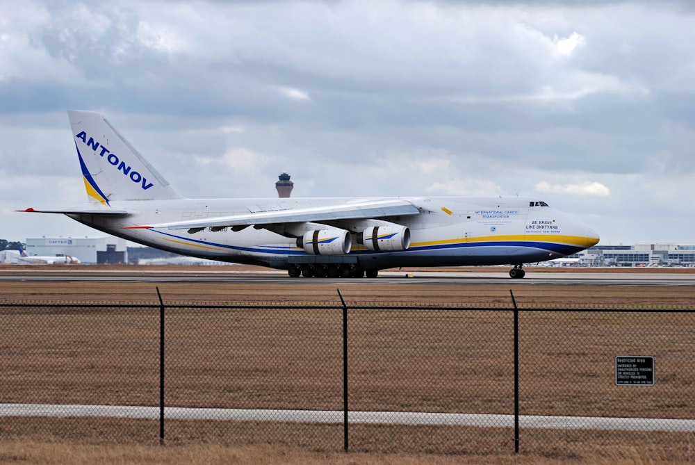 a large jetliner sitting on top of an airport runway