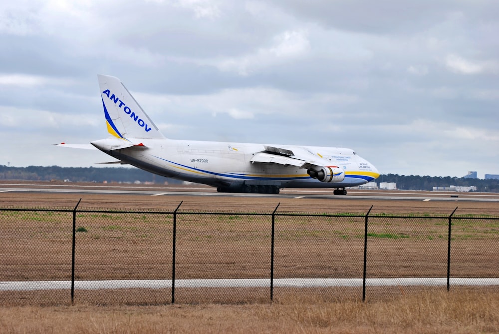 a large jetliner sitting on top of an airport runway