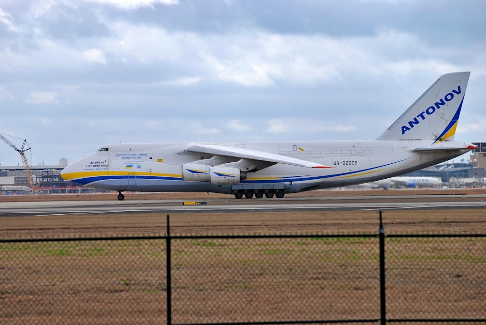 a large jetliner sitting on top of an airport runway