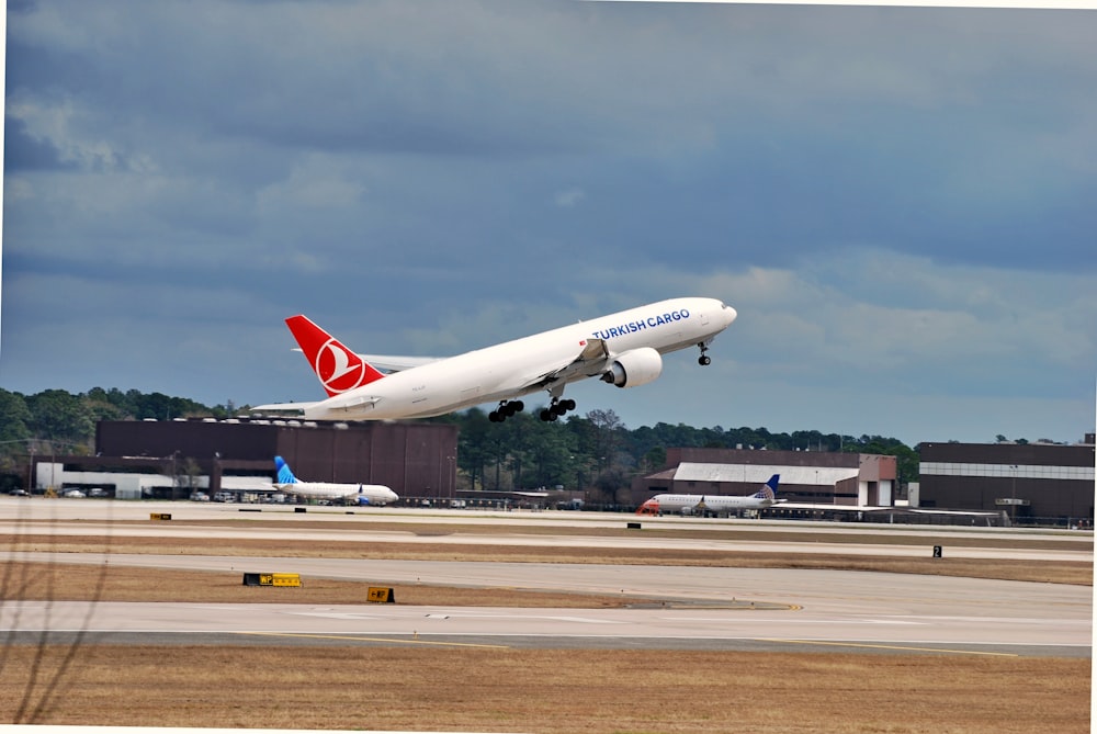 a large jetliner taking off from an airport runway