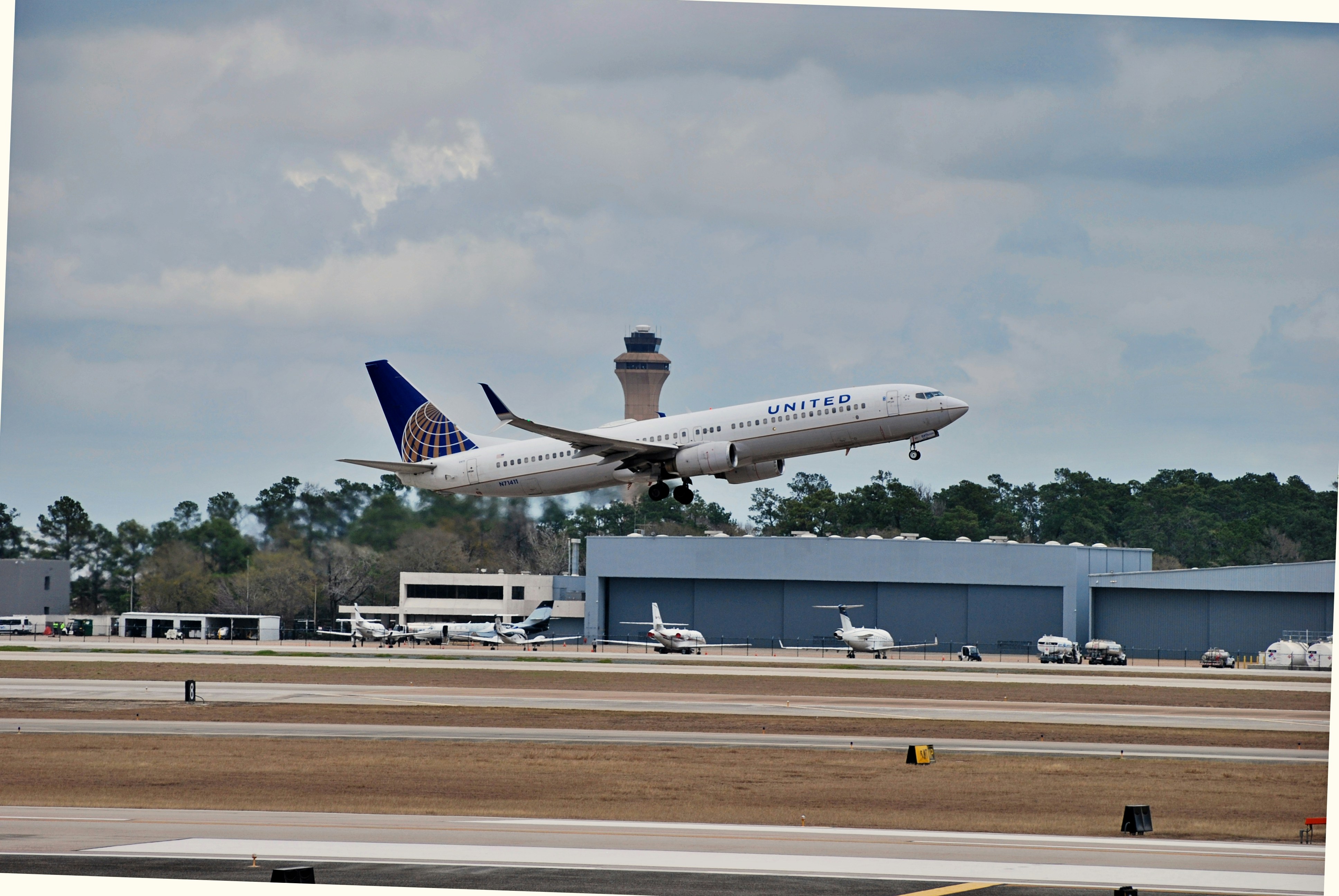 a large jetliner taking off from an airport runway