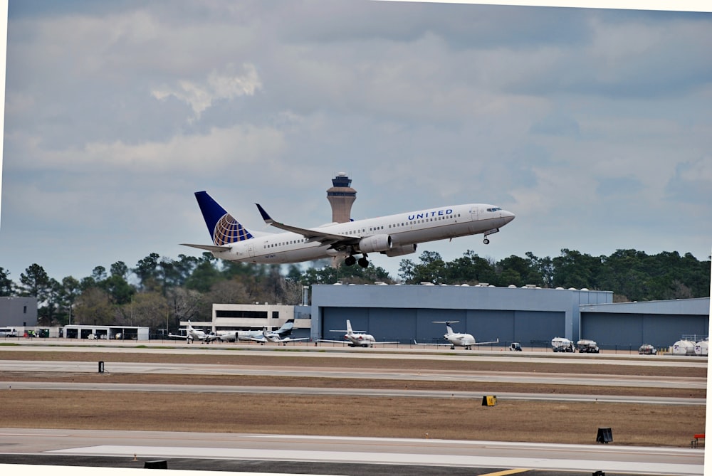 a large jetliner taking off from an airport runway