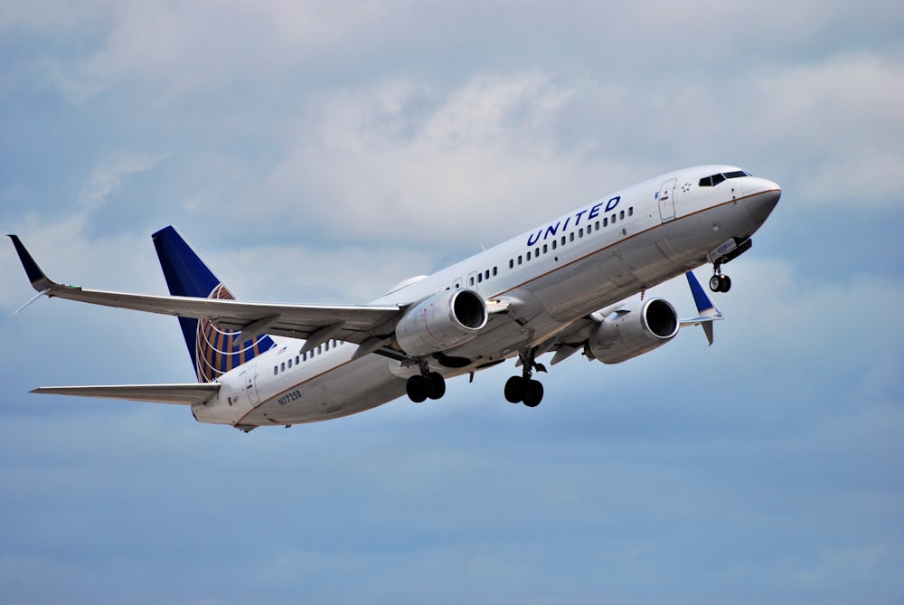 a united airlines plane flying in the sky