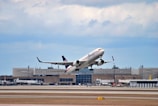 a large jetliner taking off from an airport runway