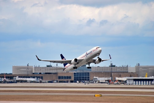a large jetliner taking off from an airport runway