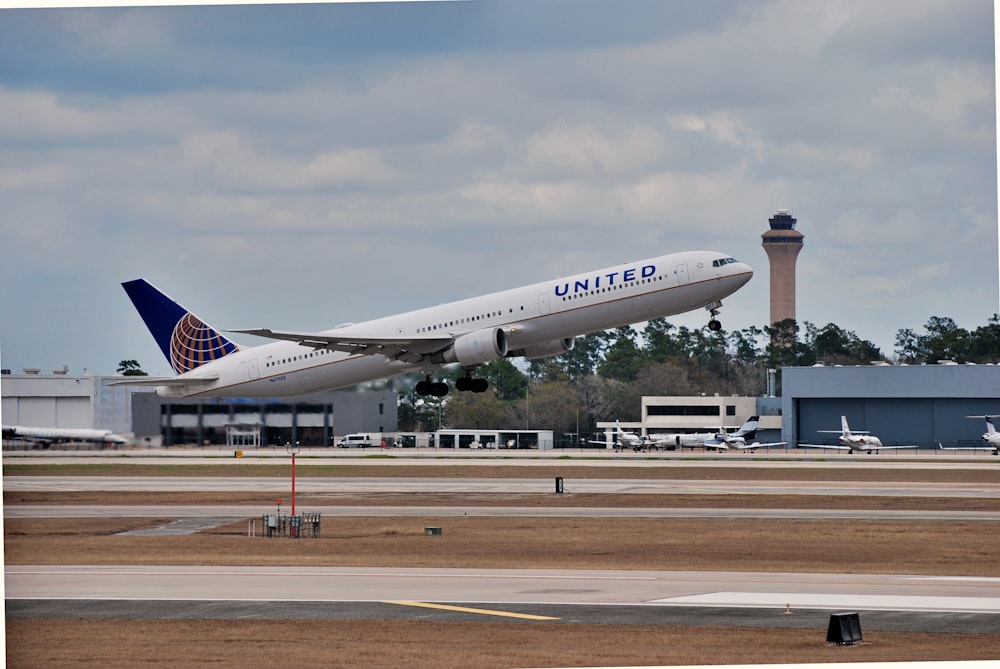 a large jetliner taking off from an airport runway