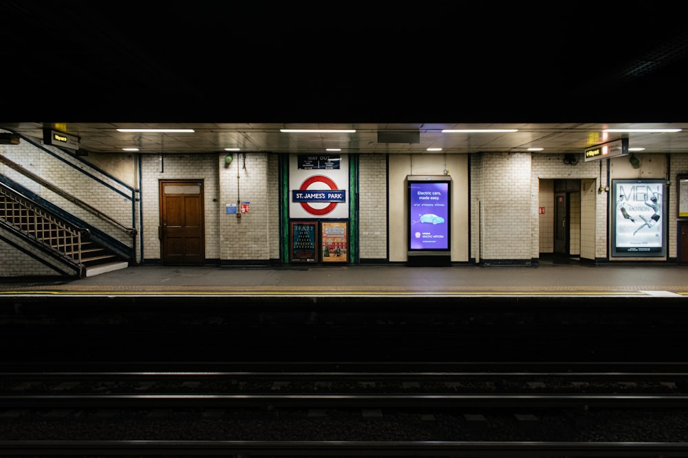 a train station with a train on the tracks