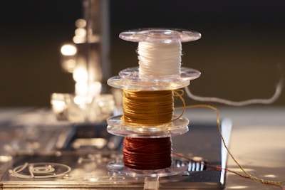 A sewing machine with colorful threads.