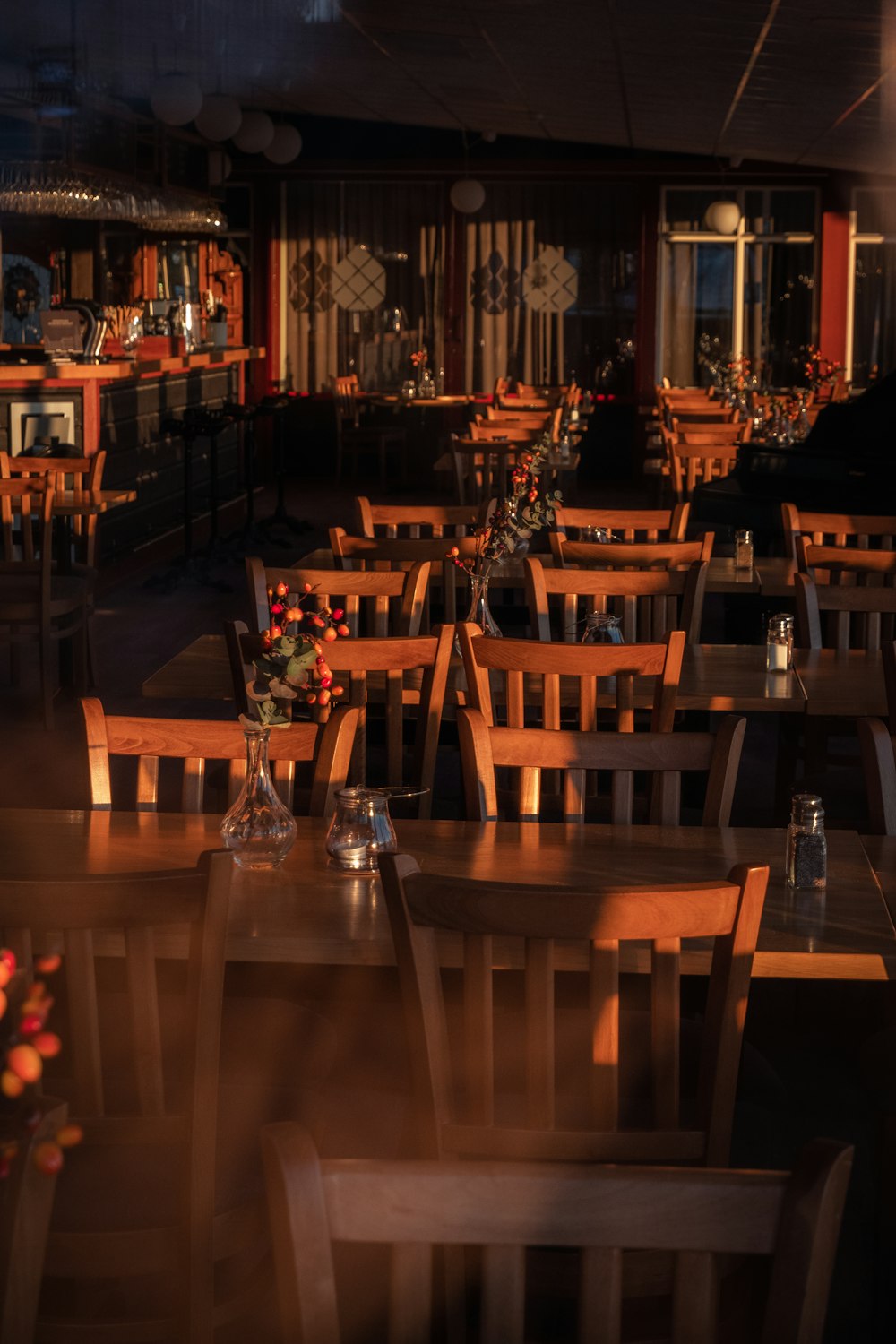 a blurry photo of a restaurant with tables and chairs