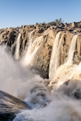a large waterfall with lots of water coming out of it