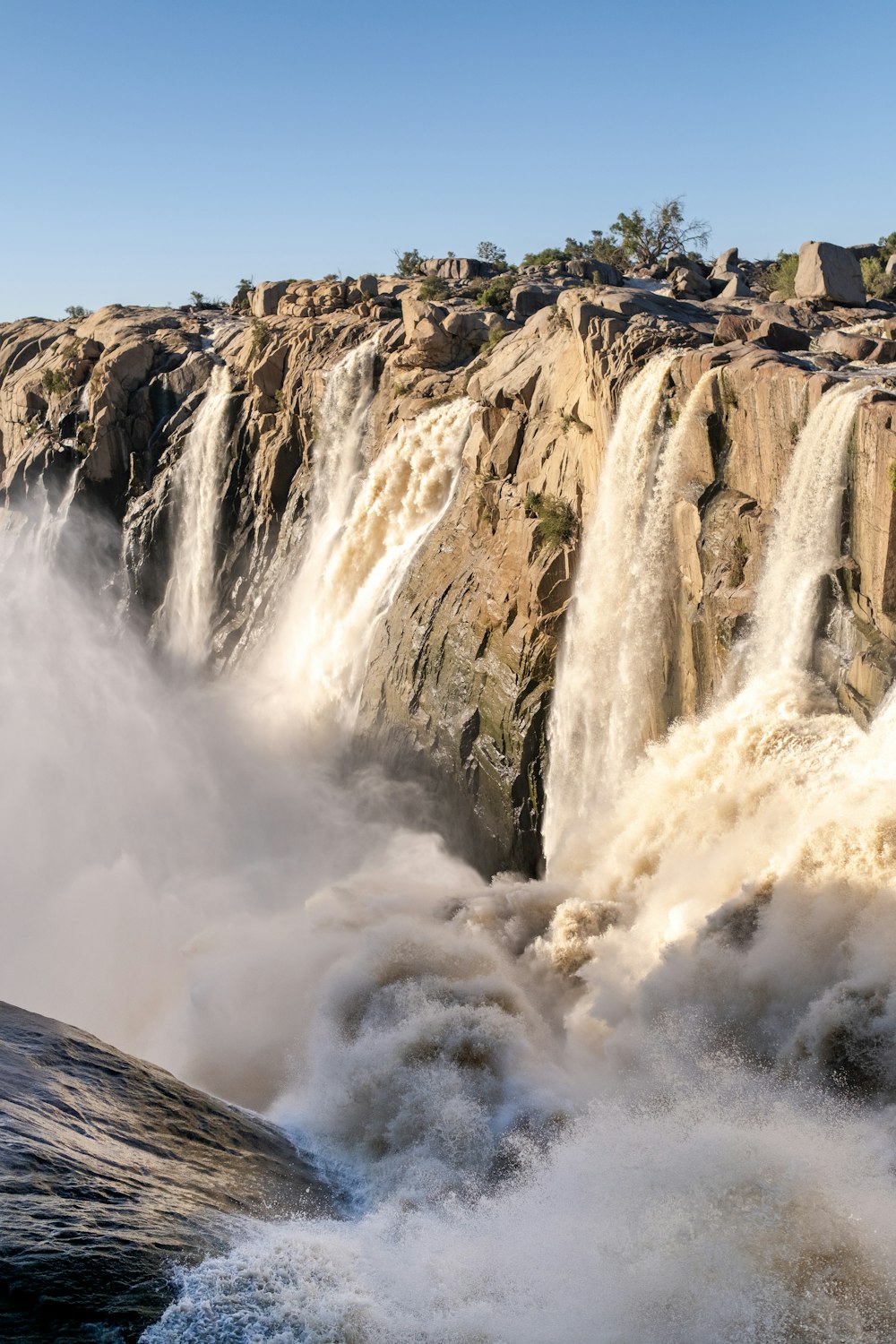 a large waterfall with lots of water coming out of it