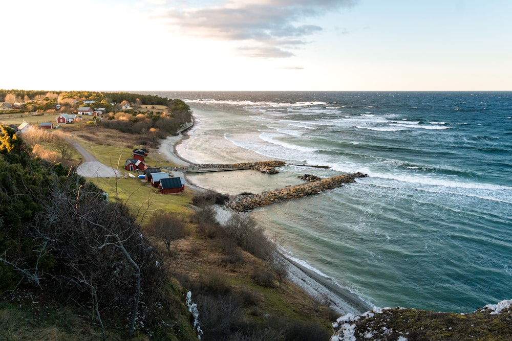 an aerial view of a beach and a pier