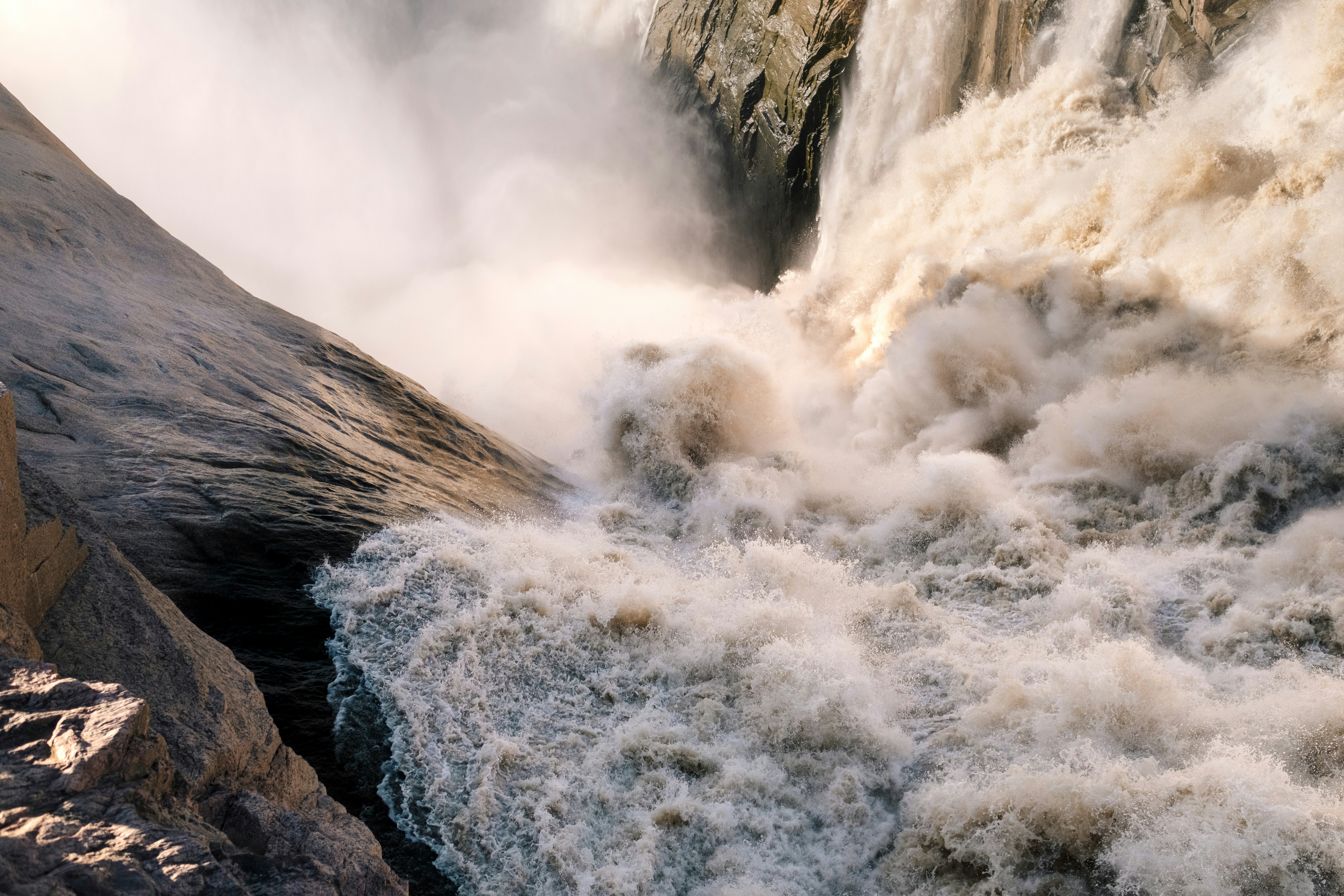a large waterfall with lots of water coming out of it