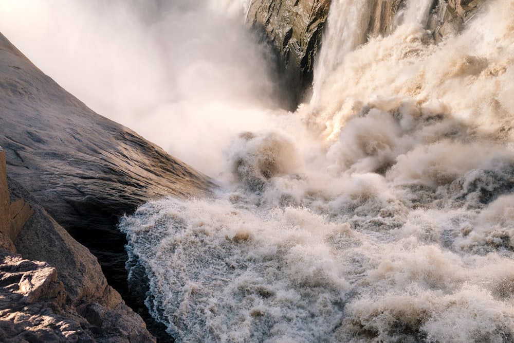 a large waterfall with lots of water coming out of it