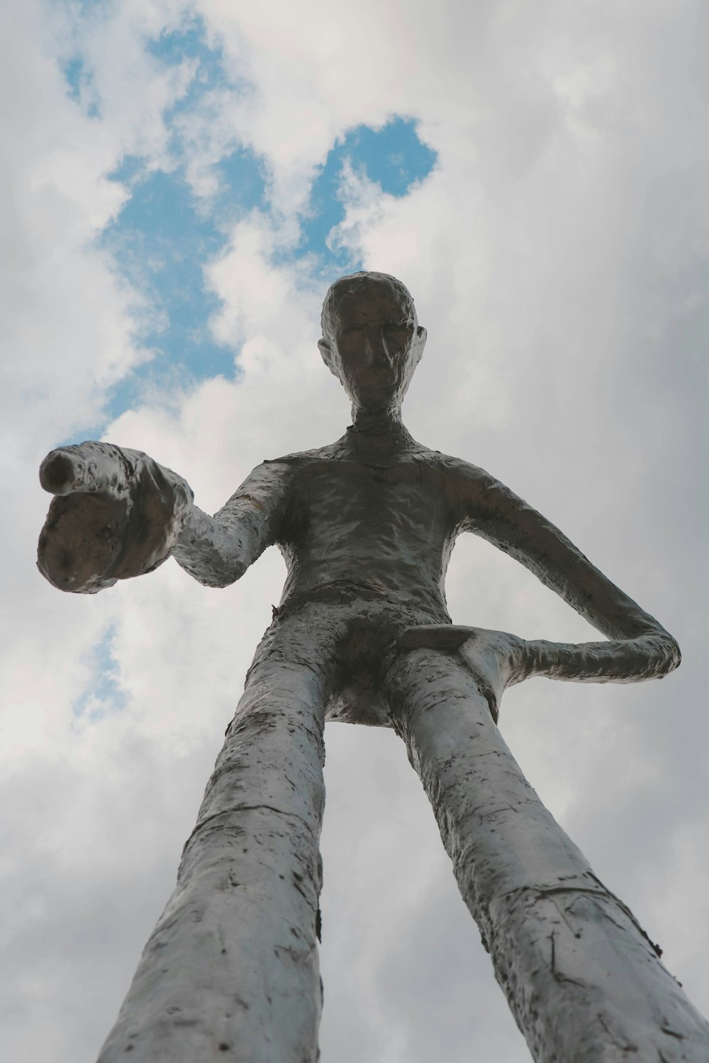 a statue of a person holding a teddy bear