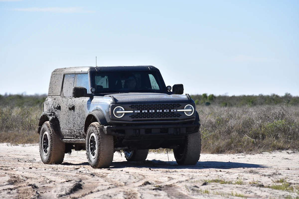 Ford Bronco on a sandy trail