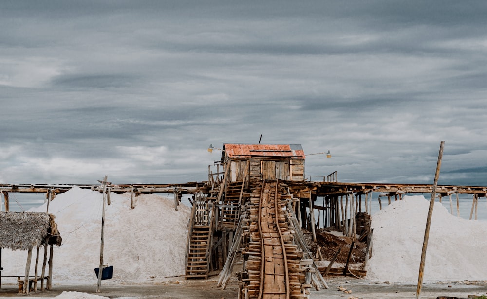 a wooden structure with a roof made of wood