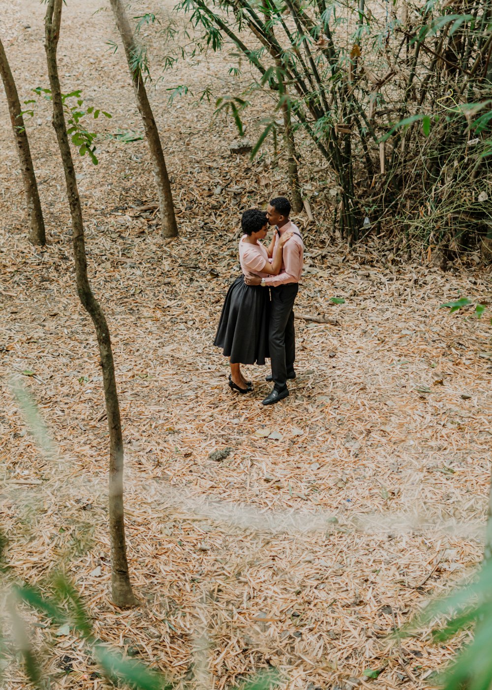 a couple of people that are standing in the dirt