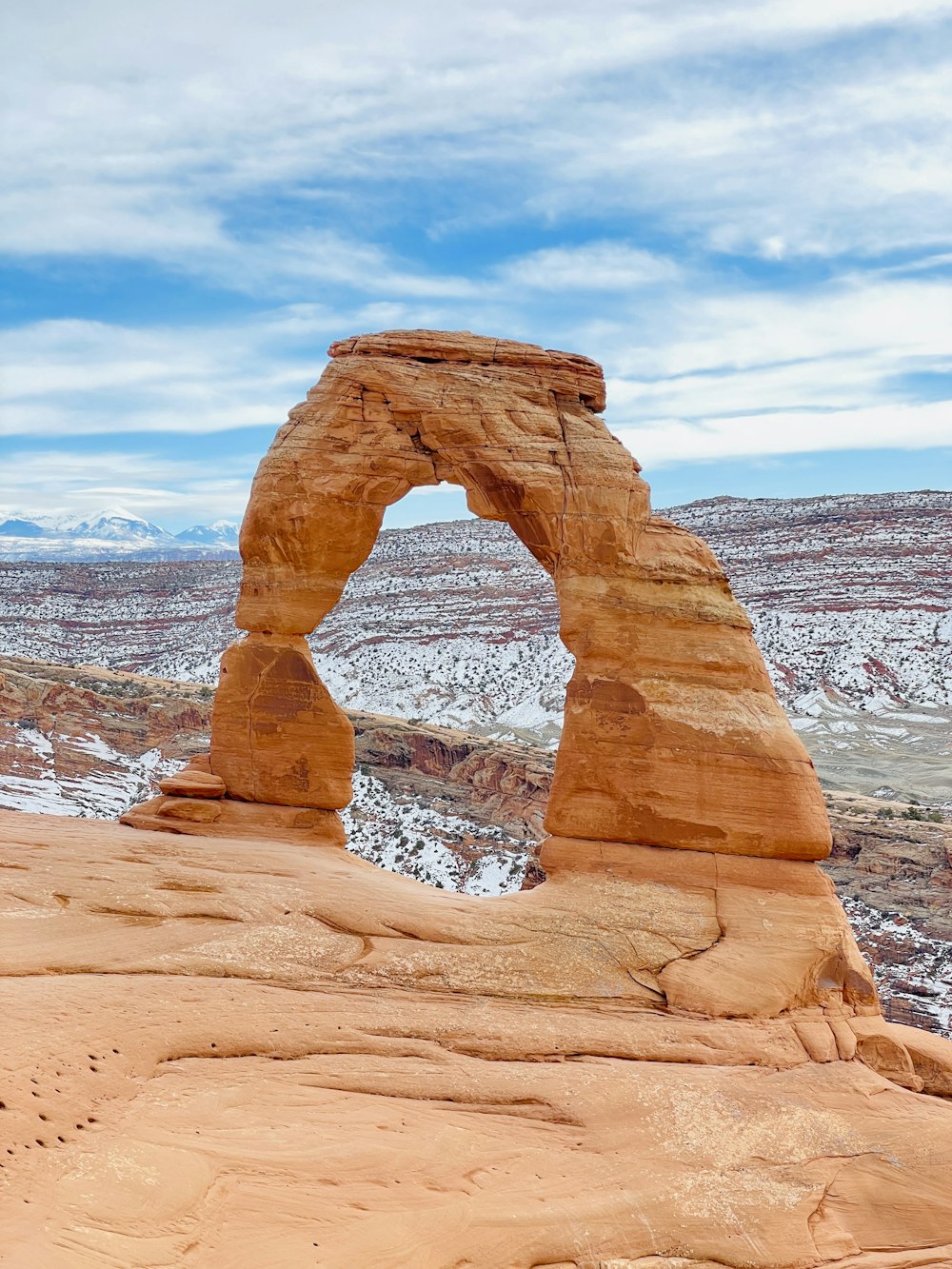 a large rock formation in the middle of a desert