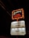 A classic cinema marquee sign illuminated against the night sky. The upper section features the text 'Gateway Twin Cinema' bordered with chasing lights, while the lower section lists movie titles such as 'Antman' and '80 for Brady', both rated PG13.