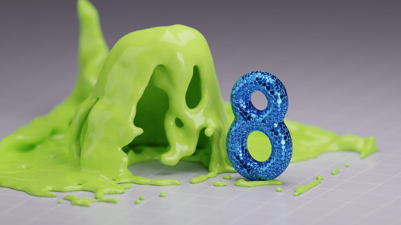 A blue, glittery number eight stands upright on a surface, surrounded by a puddle of bright green slime or liquid that appears to be spreading around it.