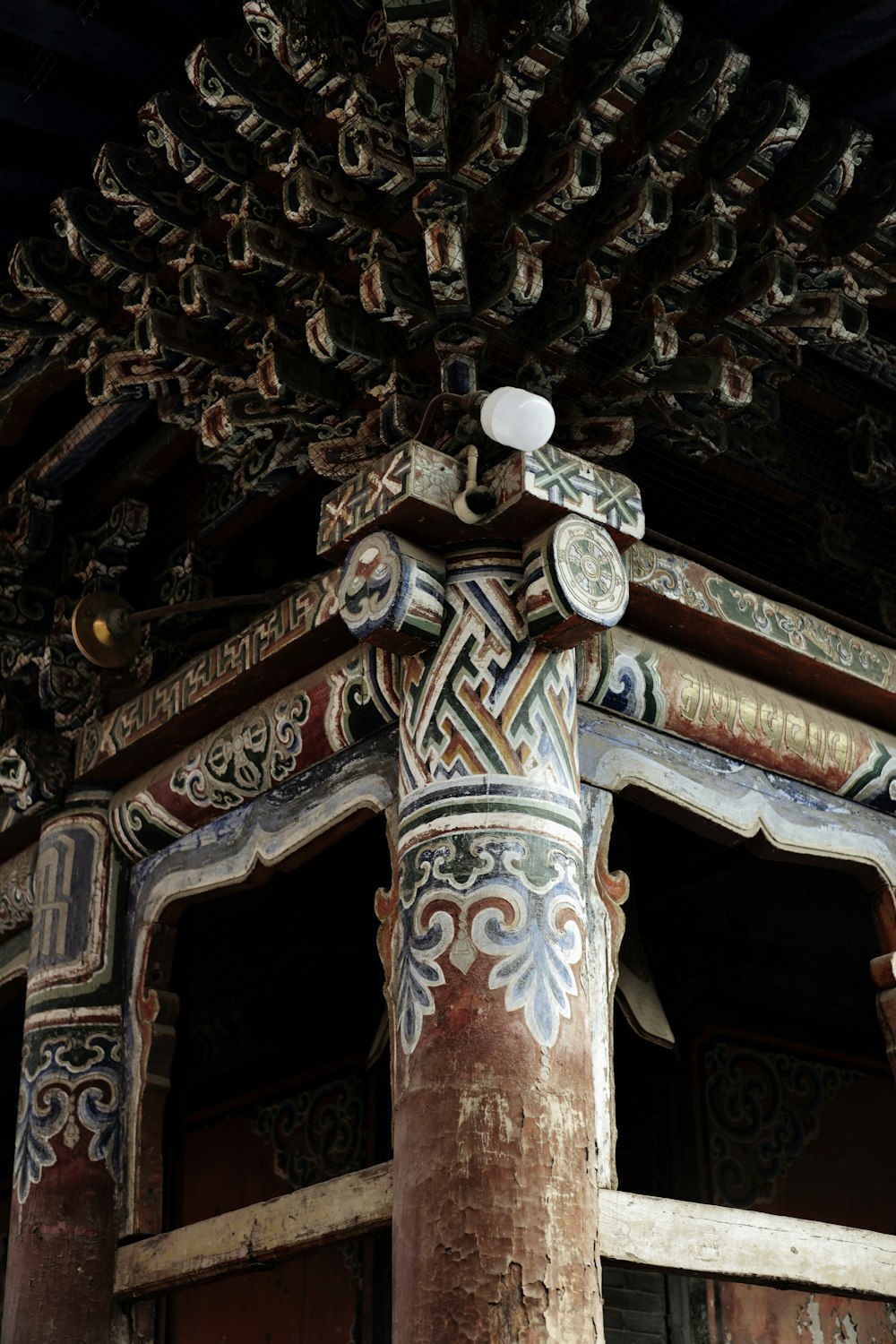 a close up of a building with a decorative roof