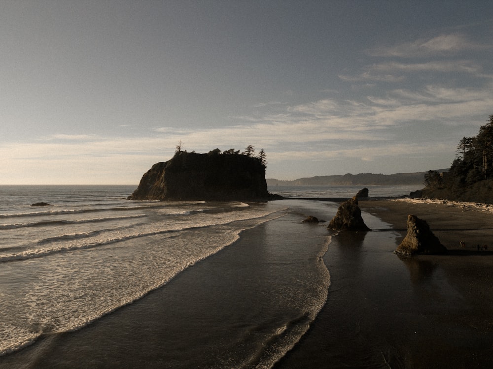 a black and white photo of a beach