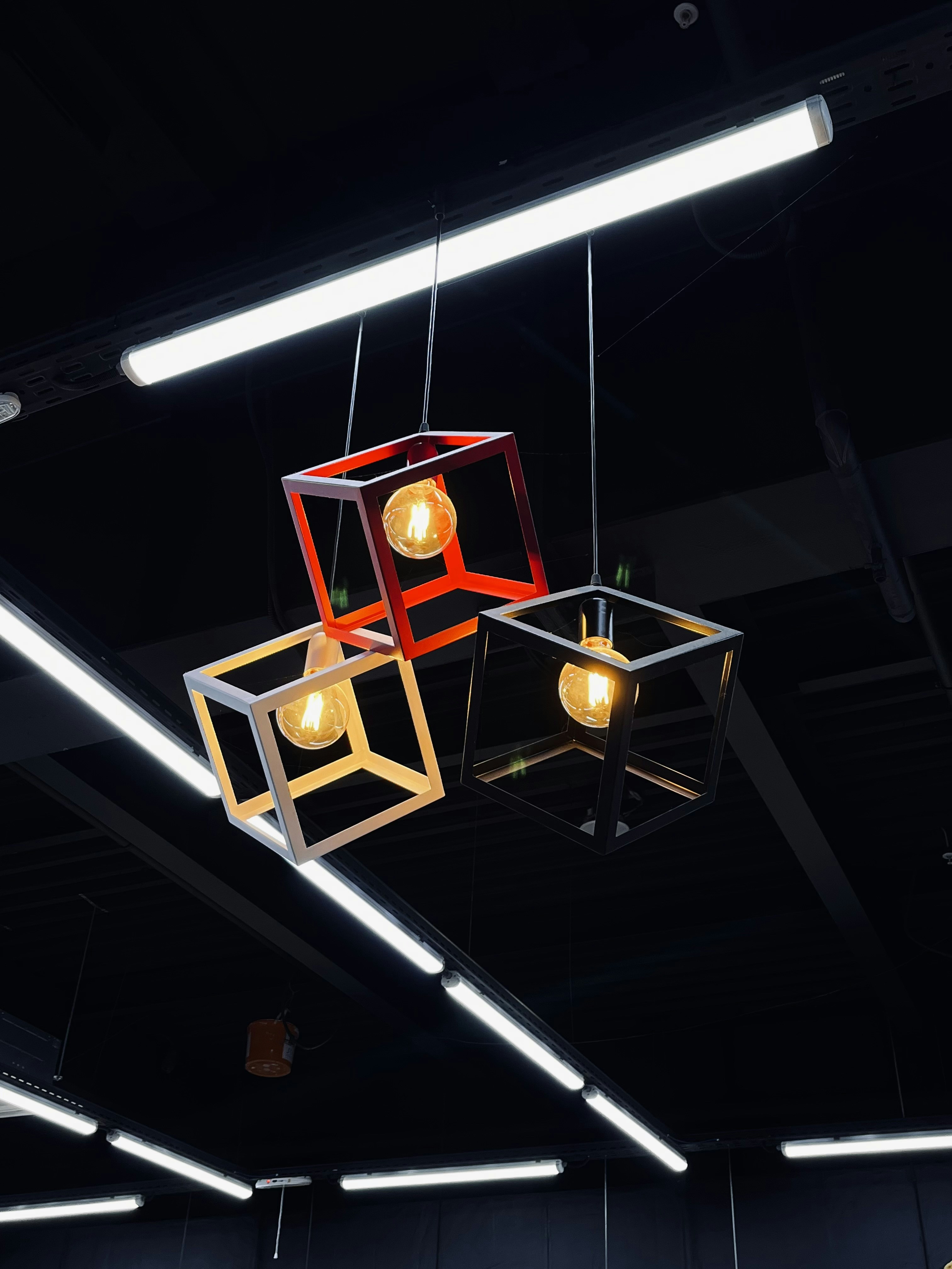 a group of lights hanging from a ceiling