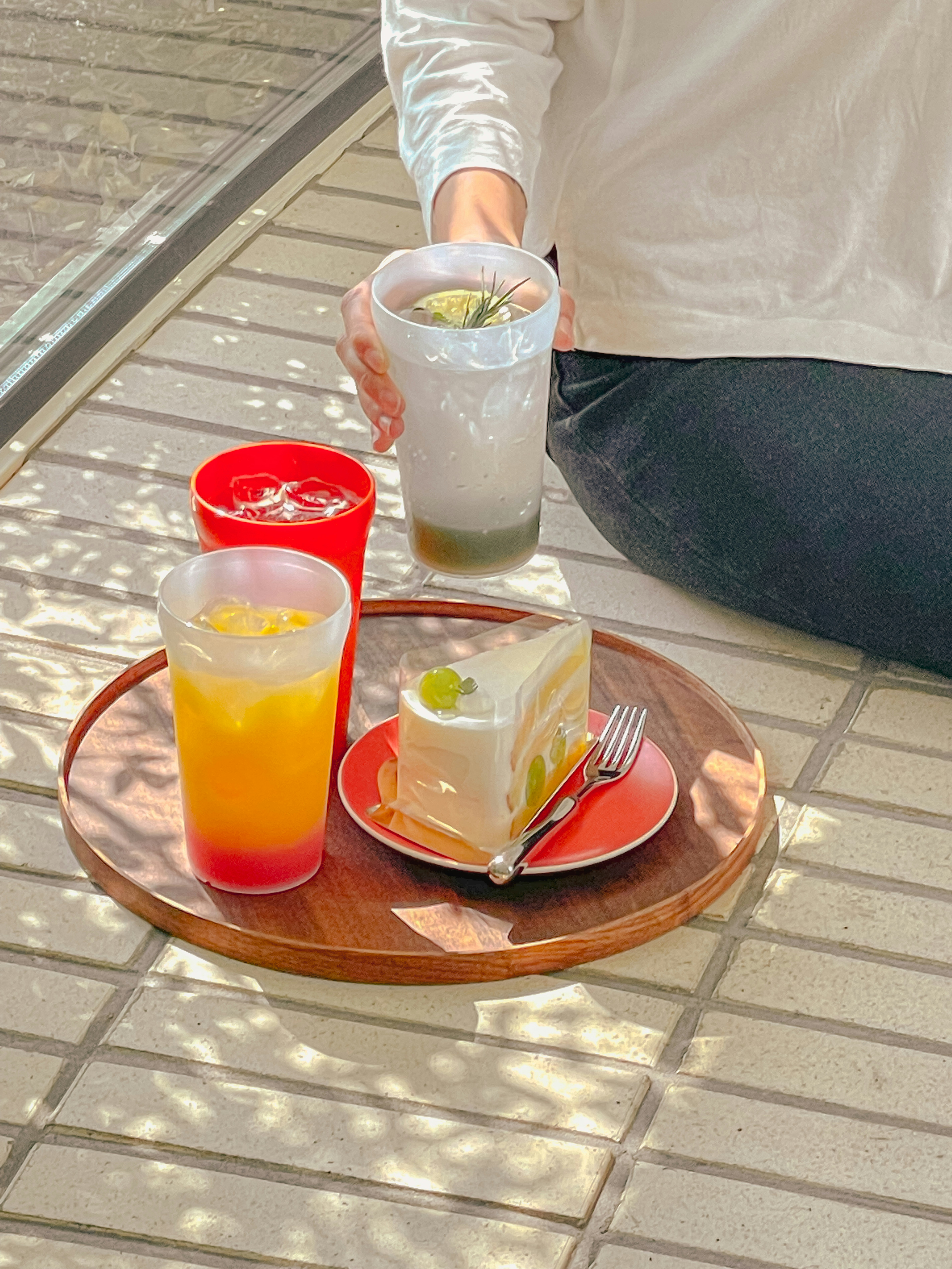 a person sitting at a table with a plate of food