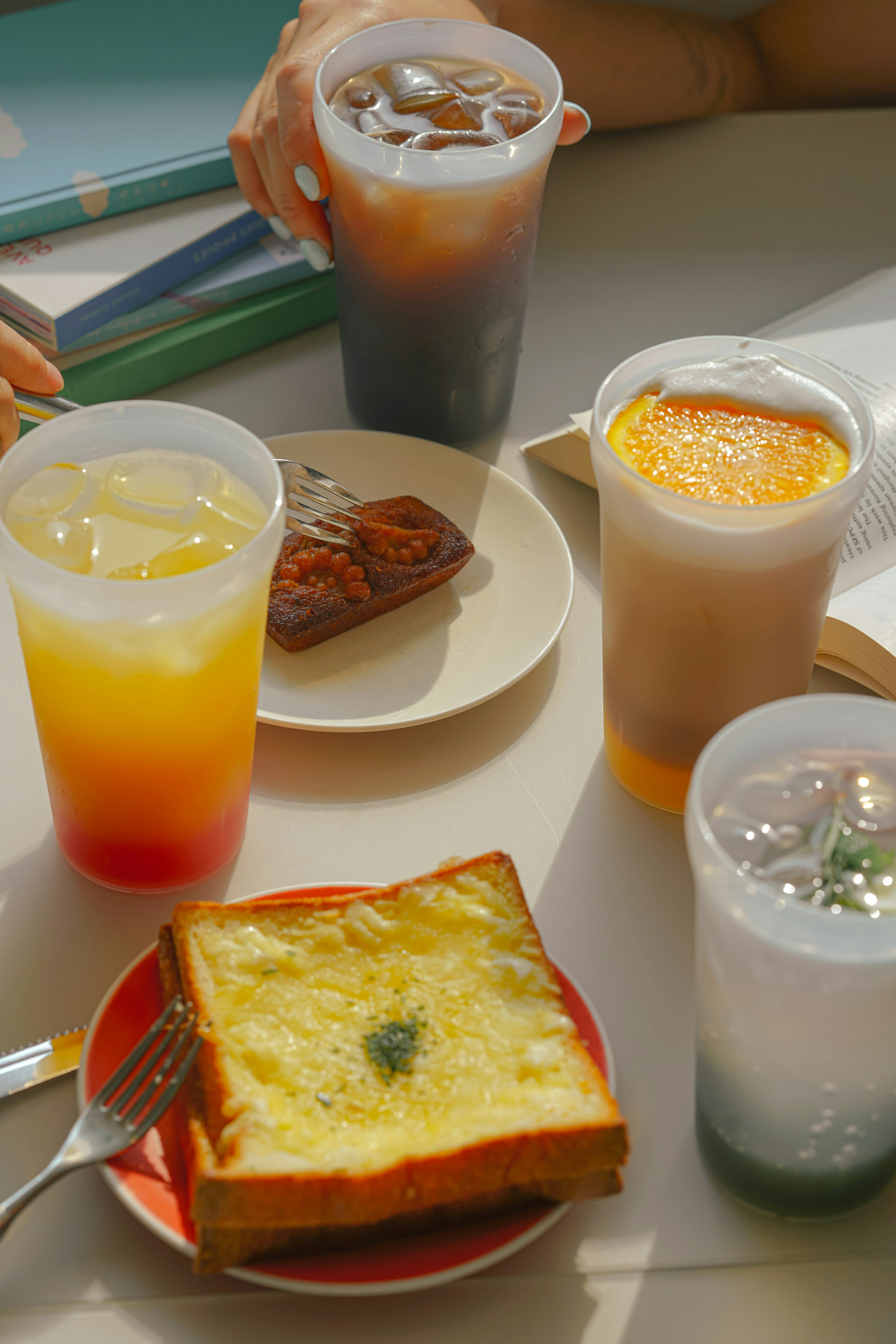a table topped with plates of food and drinks