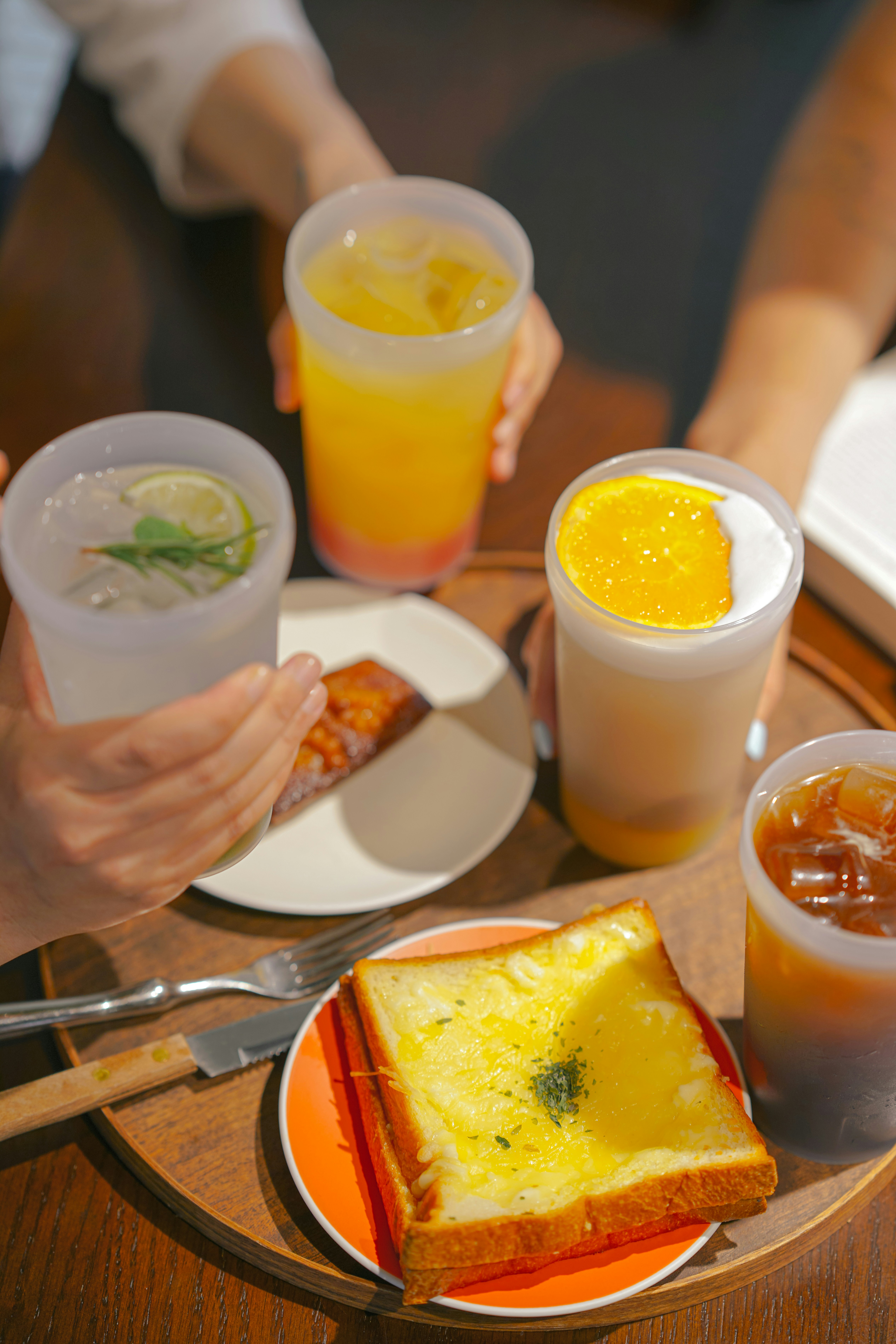 a table topped with plates of food and drinks