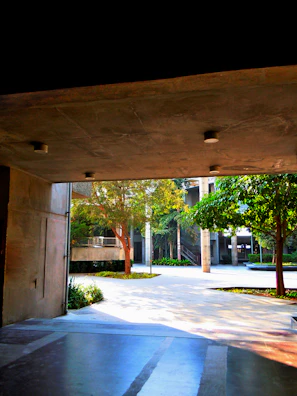 Outdoor courtyard bathed in sunlight, perfect for event breaks.