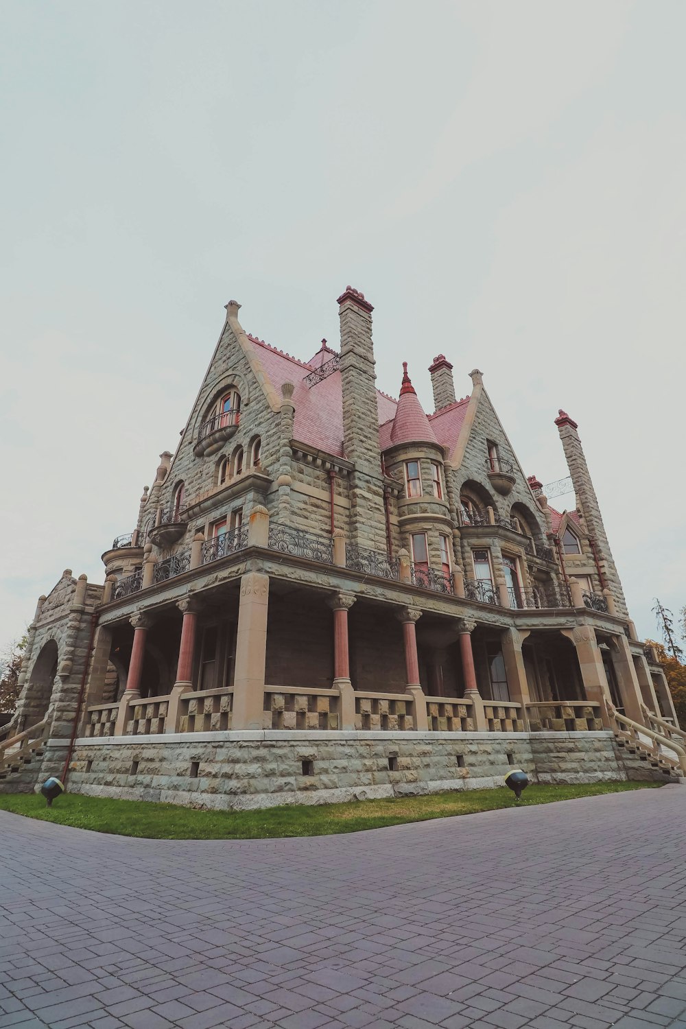 a large stone building with a red roof