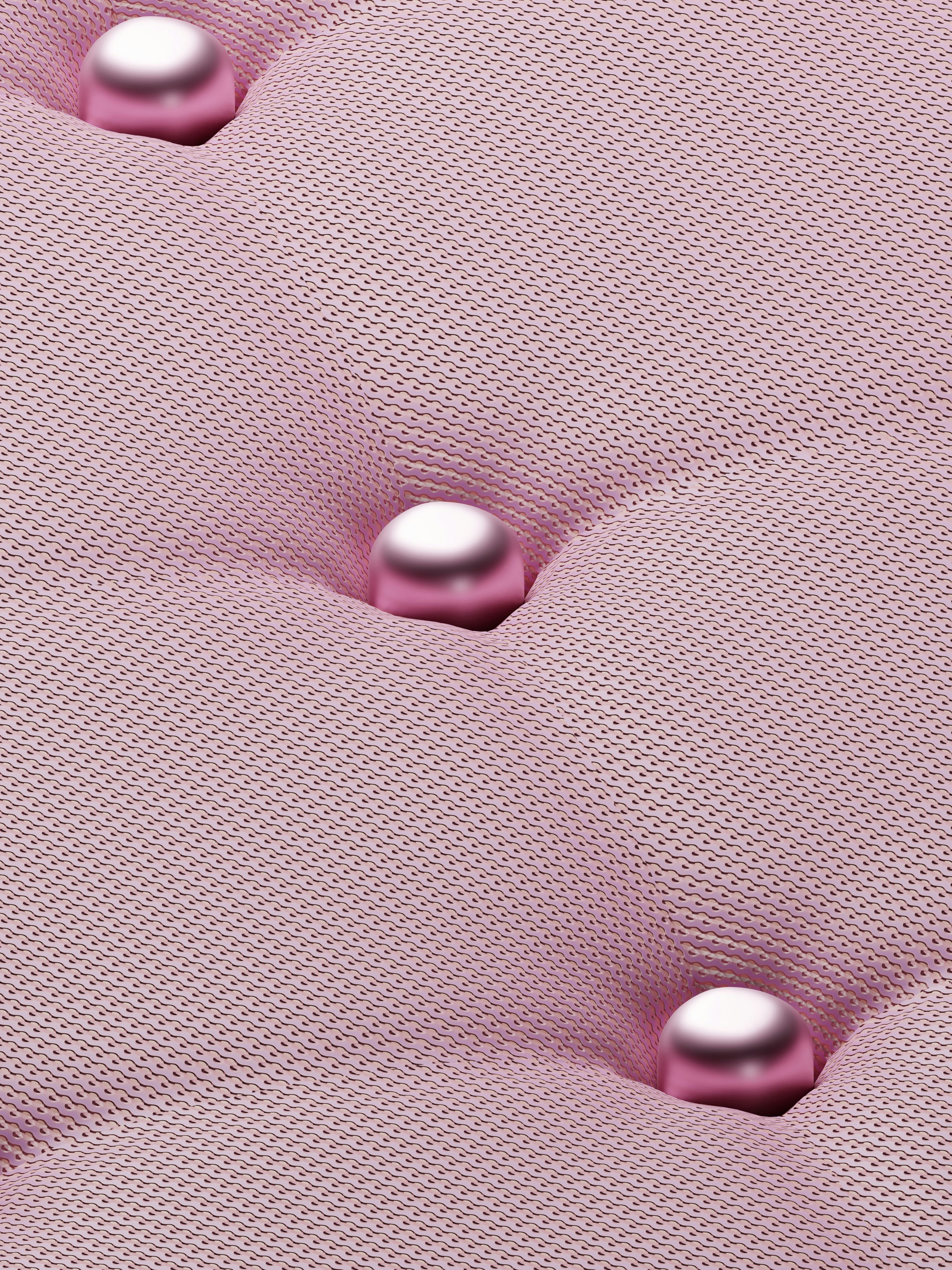 a close up of a pink upholstered material