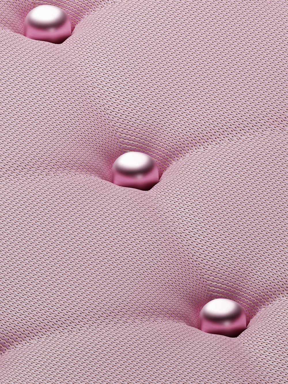 a close up of a pink upholstered material