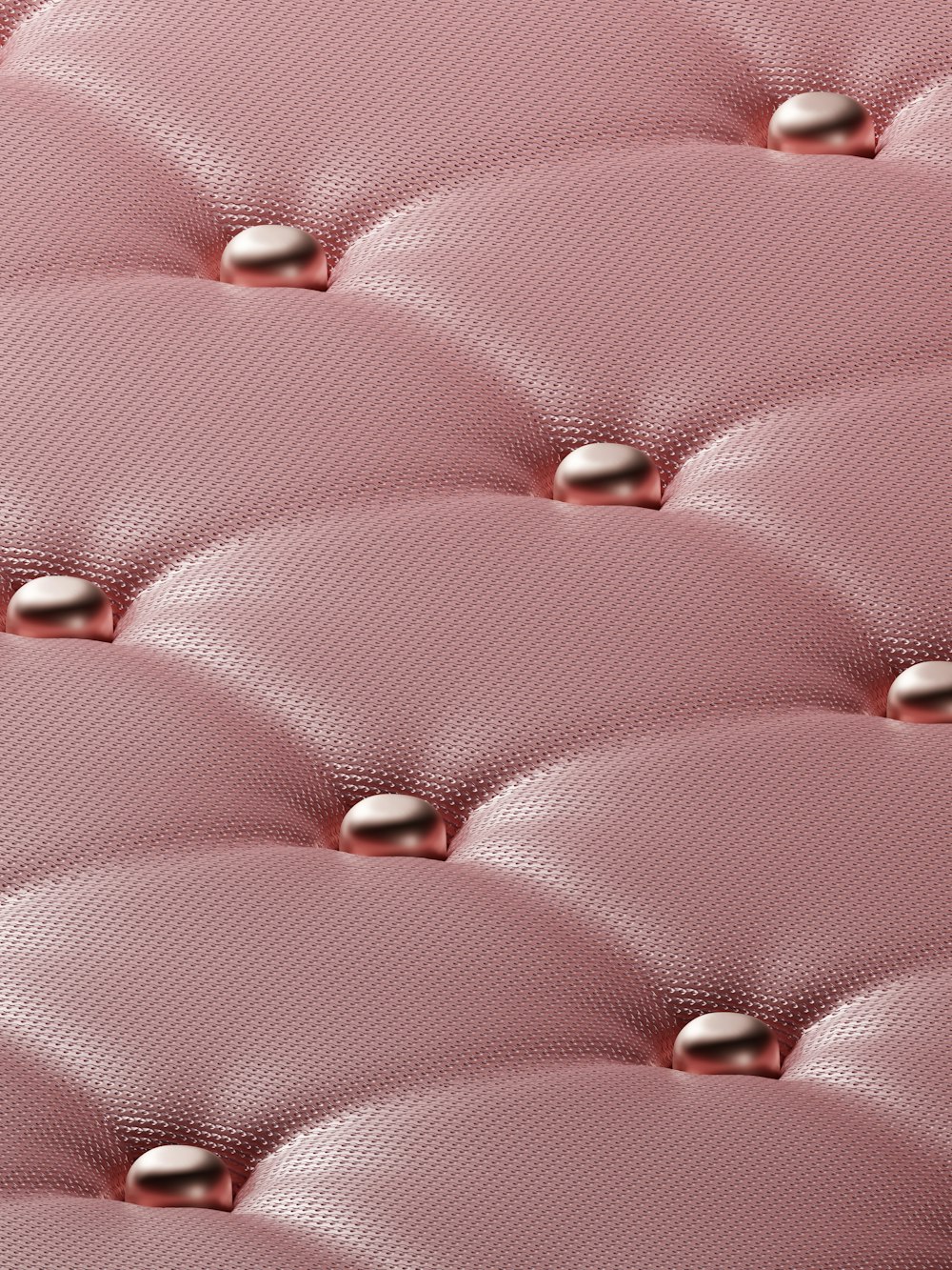 a close up of a pink leather upholster