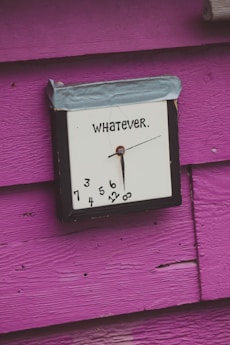 a clock that is on the side of a building