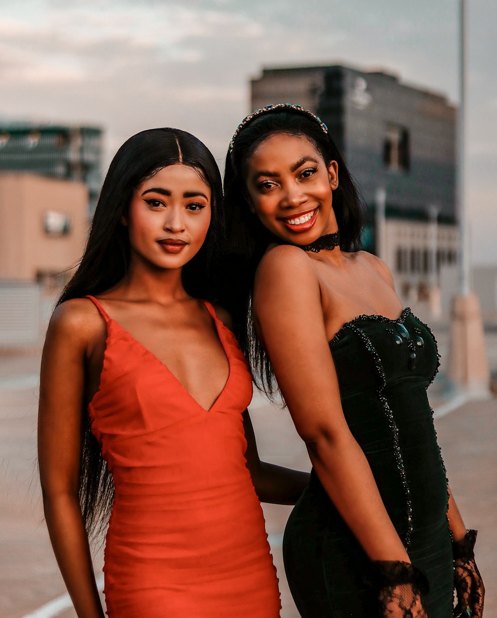 two beautiful young women standing next to each other