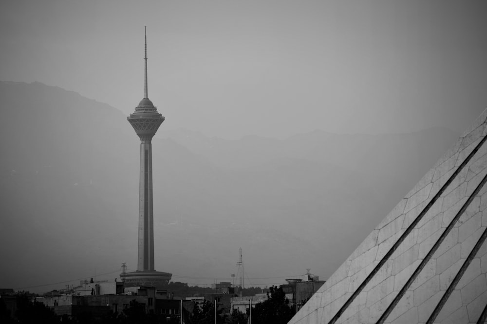 a black and white photo of a tall tower