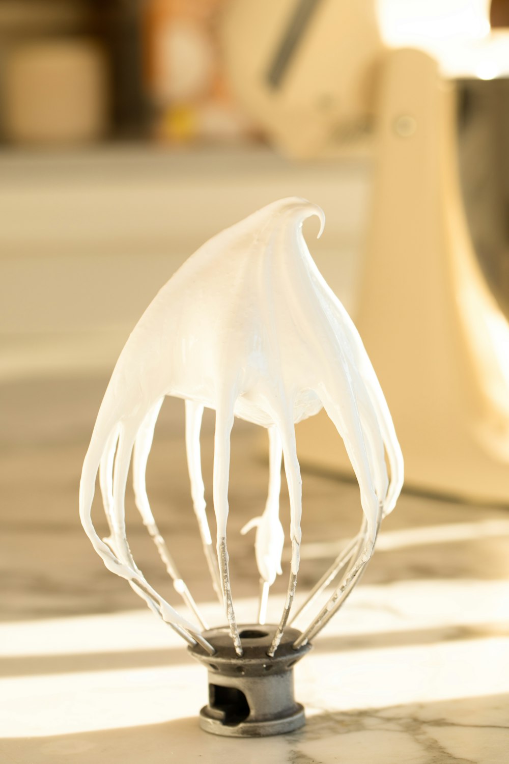 a close up of a whisk on a table