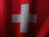 a red and white flag with a white cross on it