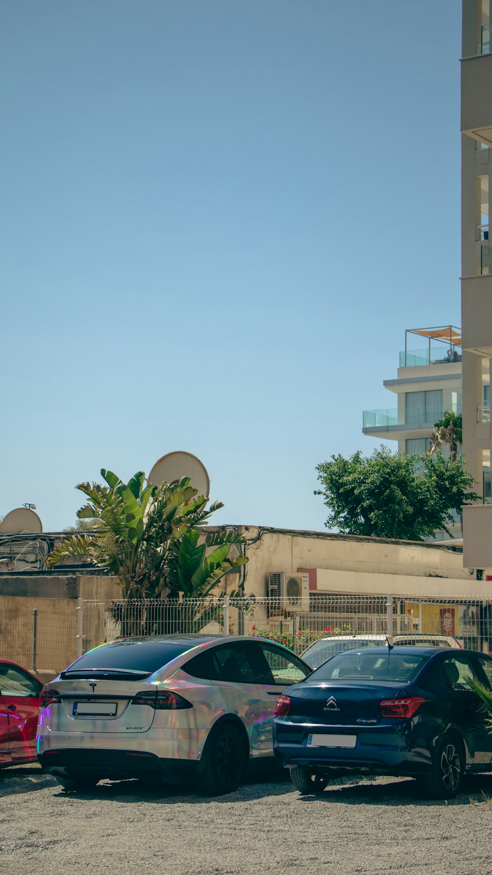 a parking lot filled with lots of parked cars