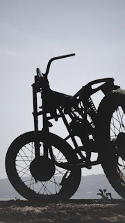 Side view of a minimalist sidecar on an urban street at sunset, emphasizing its sleek lines.