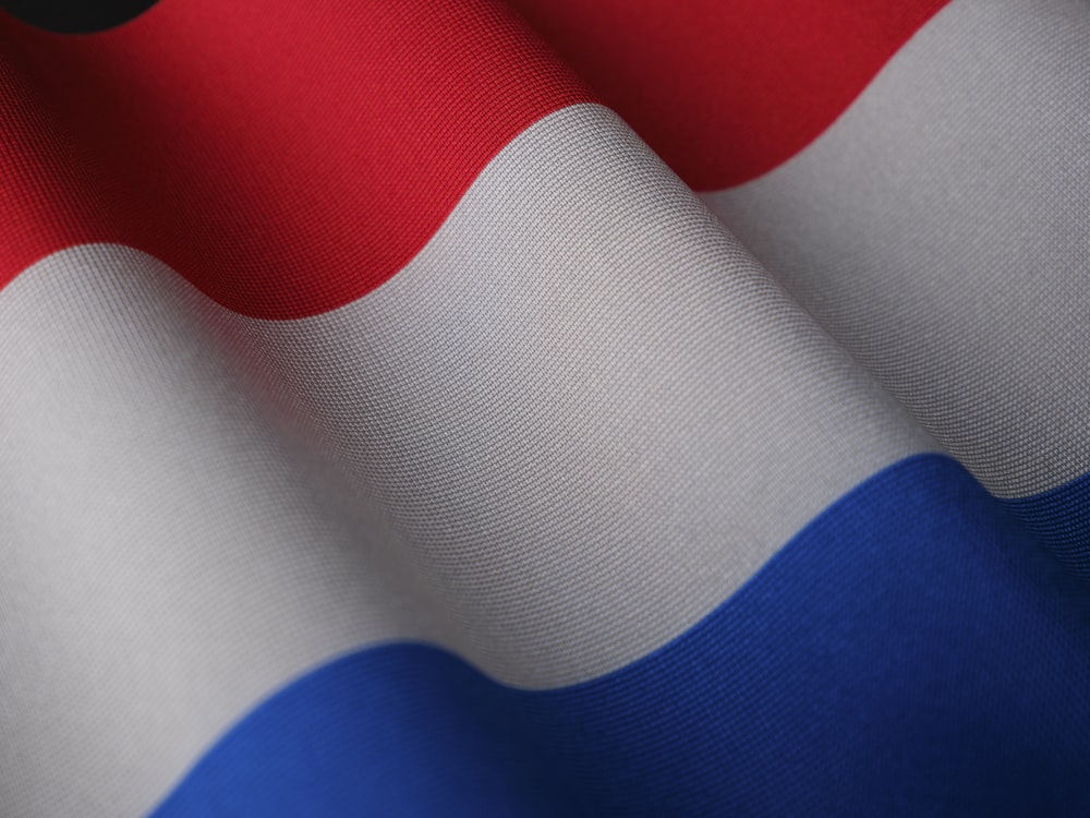 a close up of a red white and blue flag