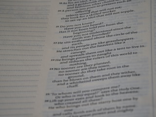 Text from a book is displayed across the right side of a page, with a margin of dotted lines on the left. The text appears to be a passage, possibly from a religious or philosophical work.