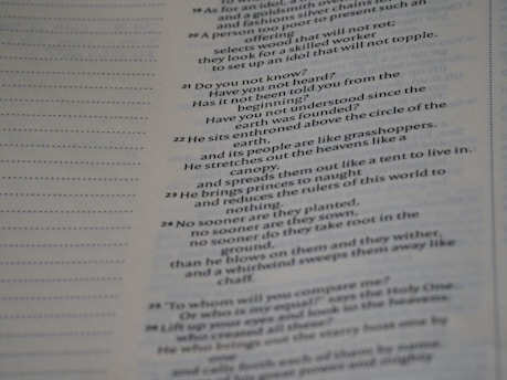 Text from a book is displayed across the right side of a page, with a margin of dotted lines on the left. The text appears to be a passage, possibly from a religious or philosophical work.